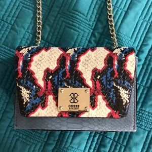 Guess blue clutch with long chain strap